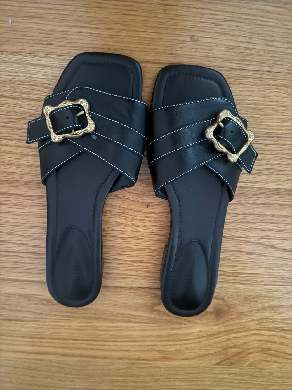 Schultz Black Slide Mules with Gold Decorative Buckles